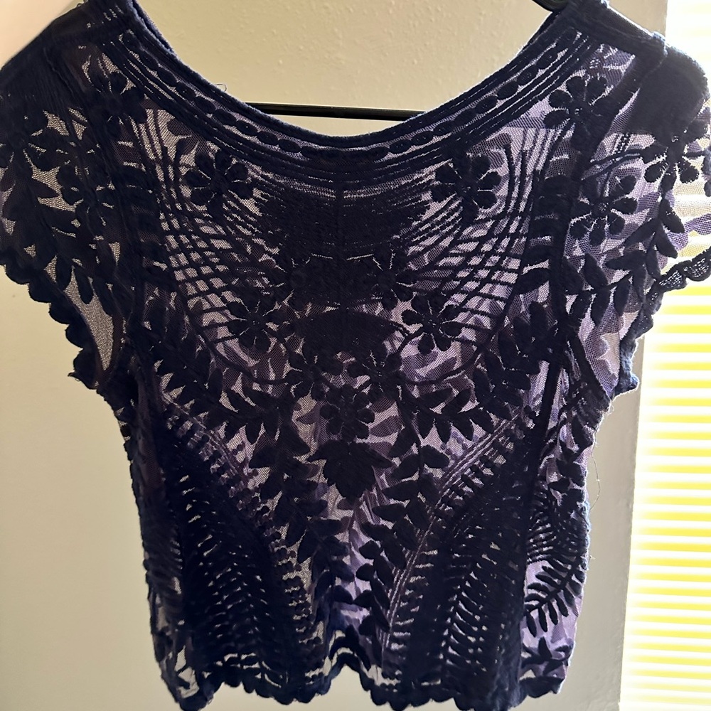An XS Mesh Top with floral pattern